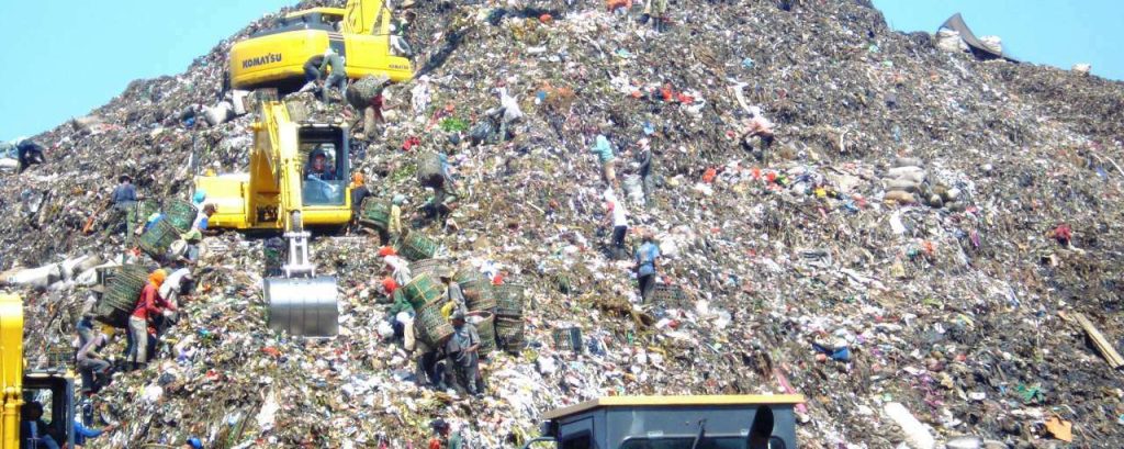 Mountain of garbage in bantar gebang with some excavator