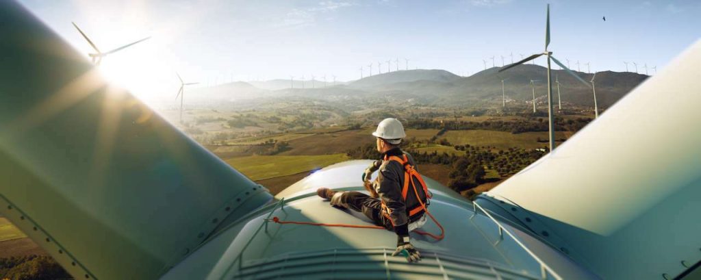 Windmolen werk man zitten zon adobe stock