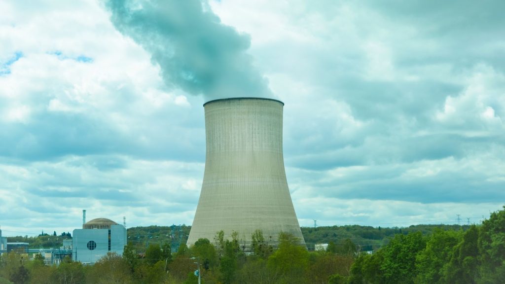 Nuclear Power Station with smoke in the sky
